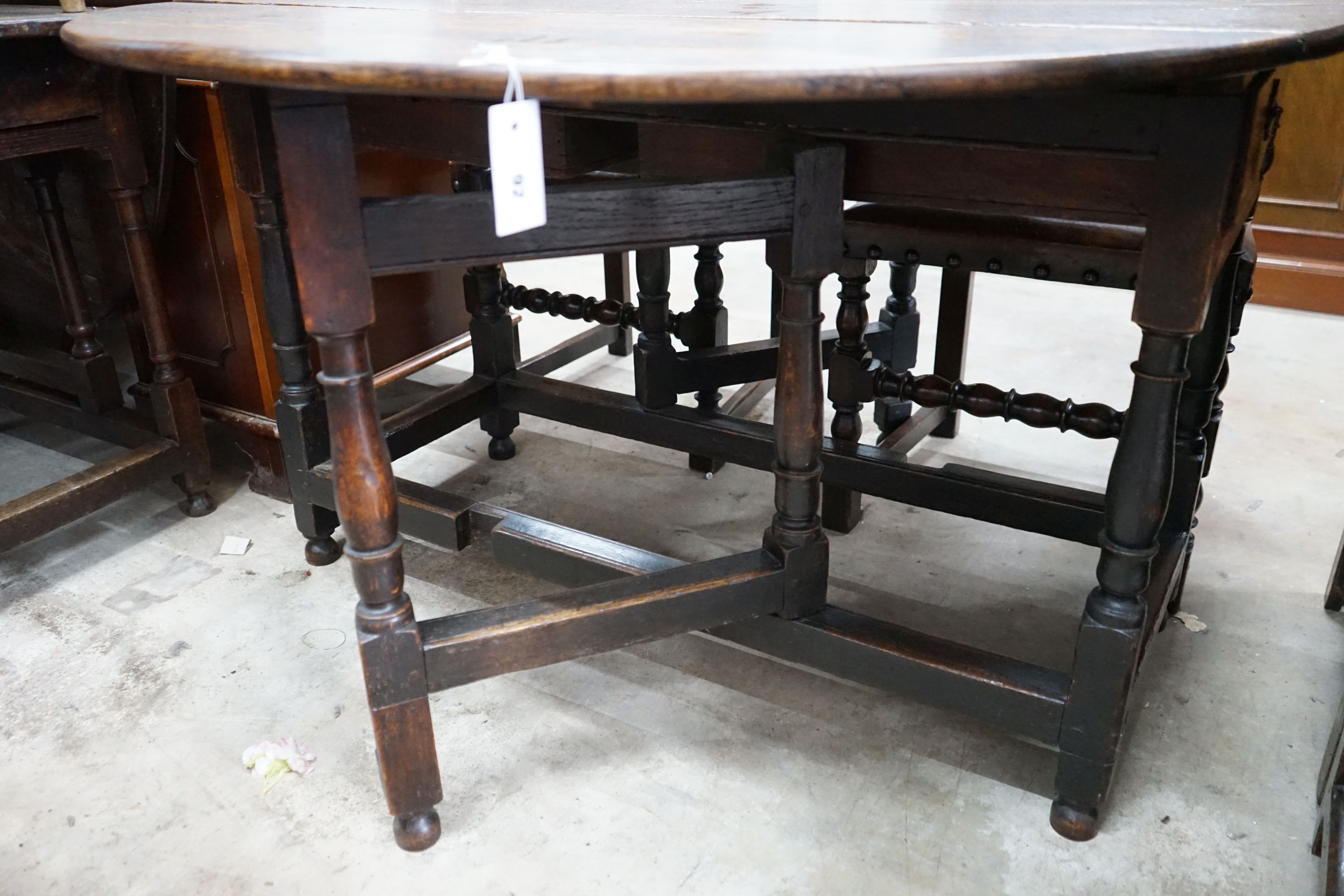 An 18th century oak gateleg table, 120cm extended, width 122cm, height 73cm